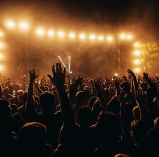 silhouettes-of-concert-crowd-in-front-of-bright-st-2026-03-25-04-41-22-utc